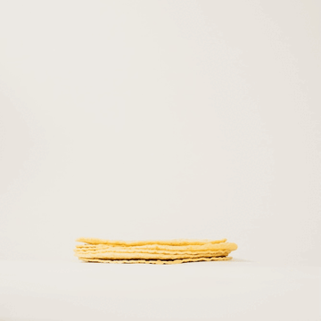 Fun gif of a person touching a stack of soft tortilla chips and turning into fried beef tallow tortilla chips