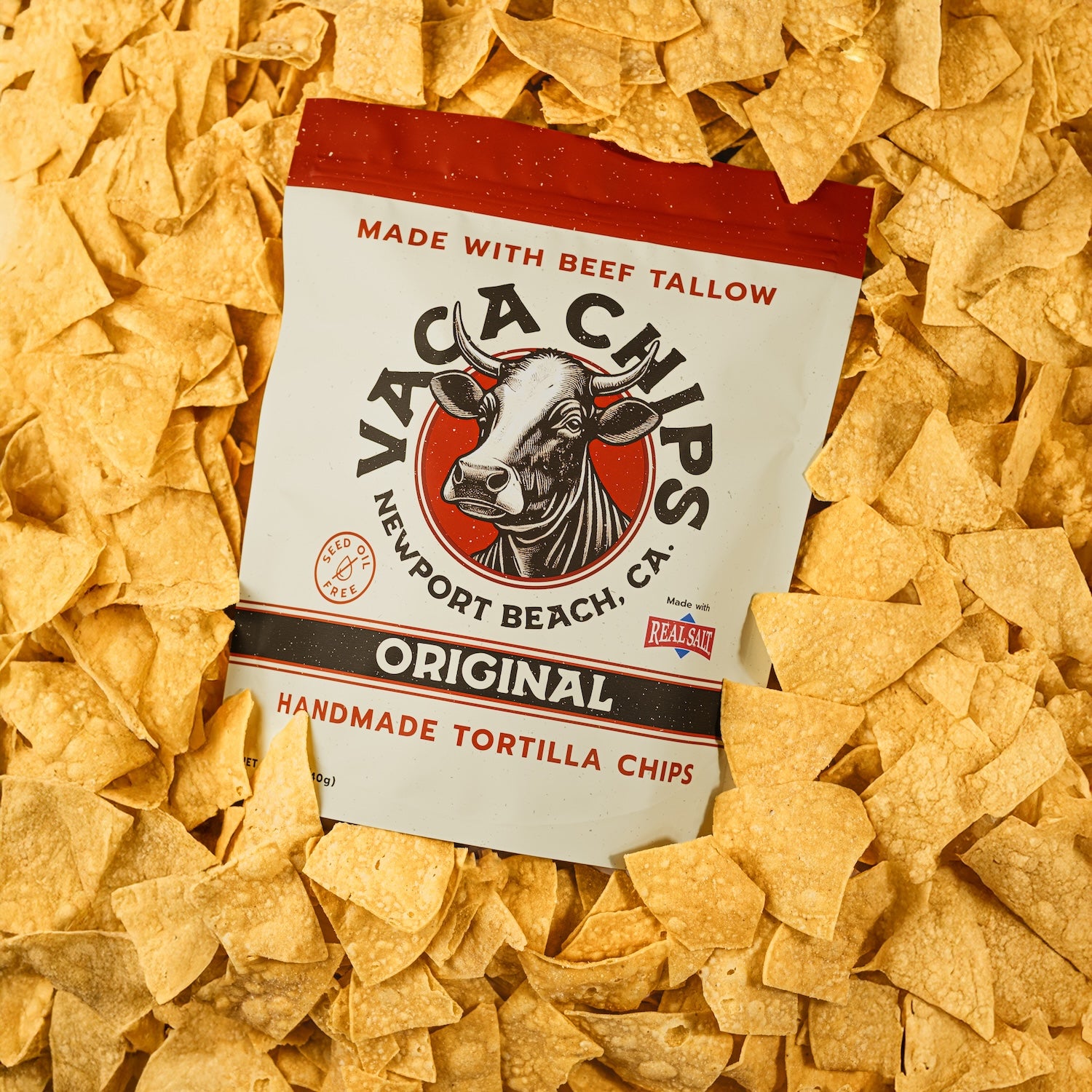 Yaca Chips packaging surrounded by tortilla chips